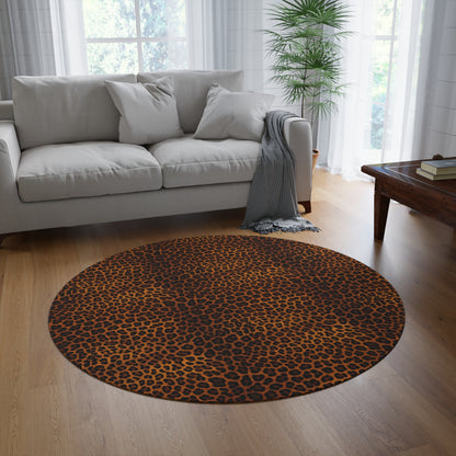 Leopard round rug on a wooden floor in front of a grey sofa