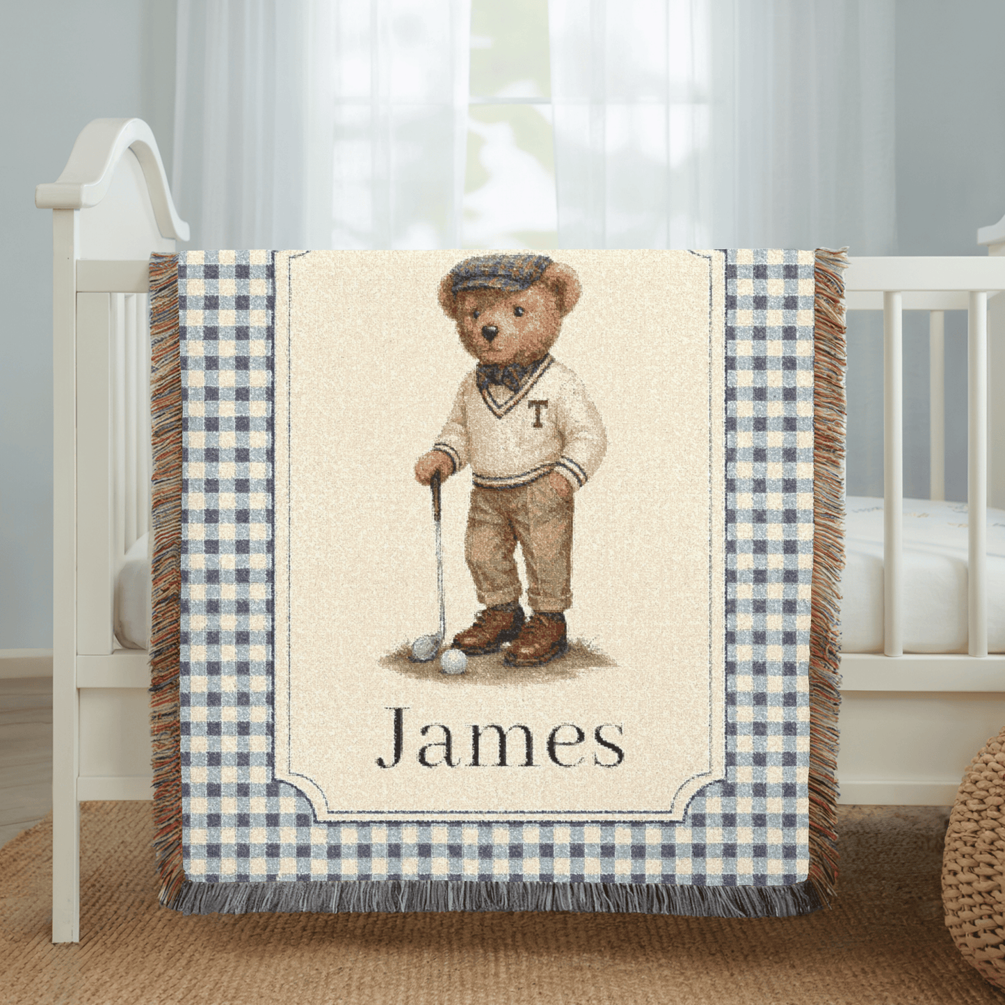 Personalized bear golf baby blanket spread on a bed in a bright bedroom
