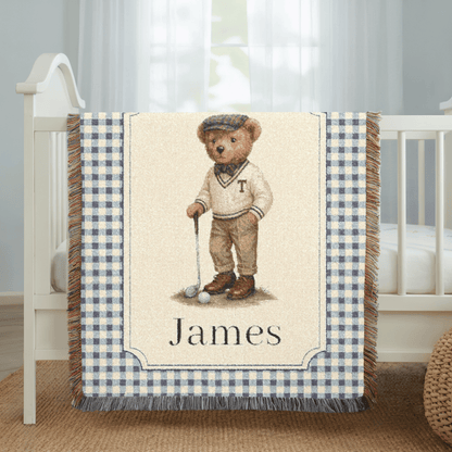 Personalized bear golf baby blanket spread on a bed in a bright bedroom