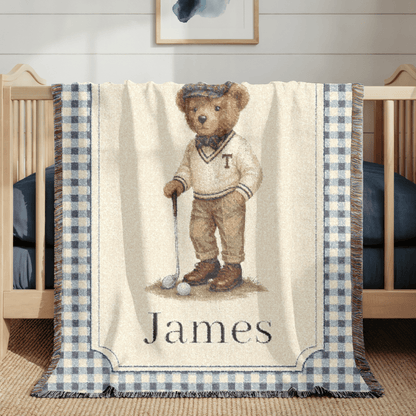 Personalized bear golf baby blanket hanging over a wooden crib