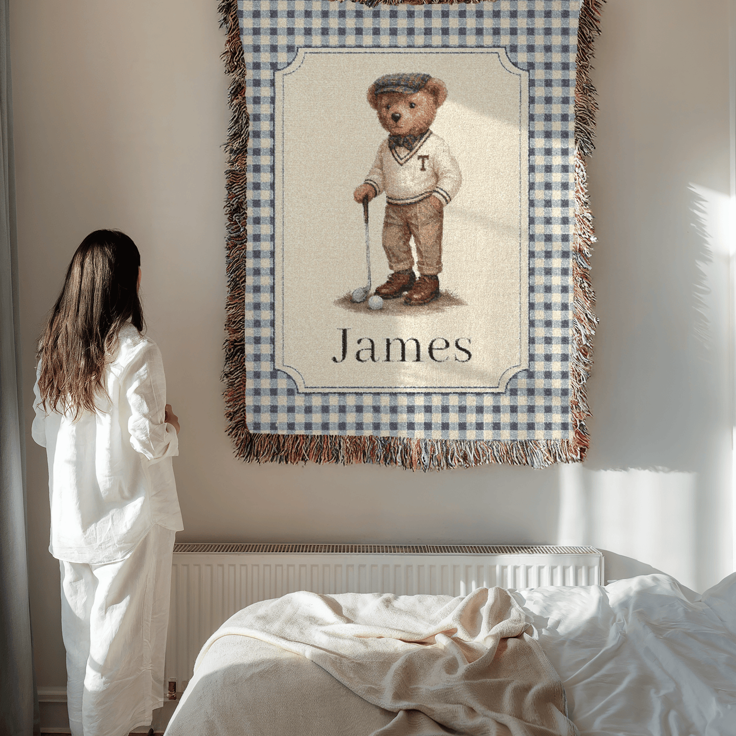 Mother holding the personalized bear golf baby blanket in a bedroom