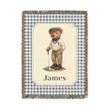 Personalized woven baby blanket with a golfing teddy bear and a name on a blue gingham border, shown flat