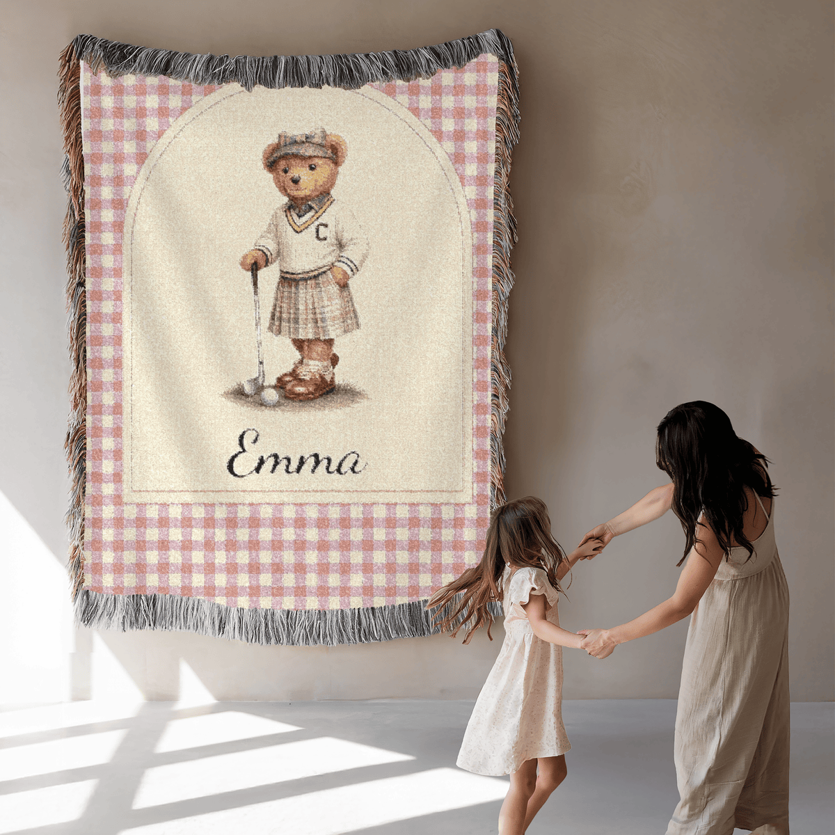 Personalized bear golf baby blanket in a nursery with the matching round rug