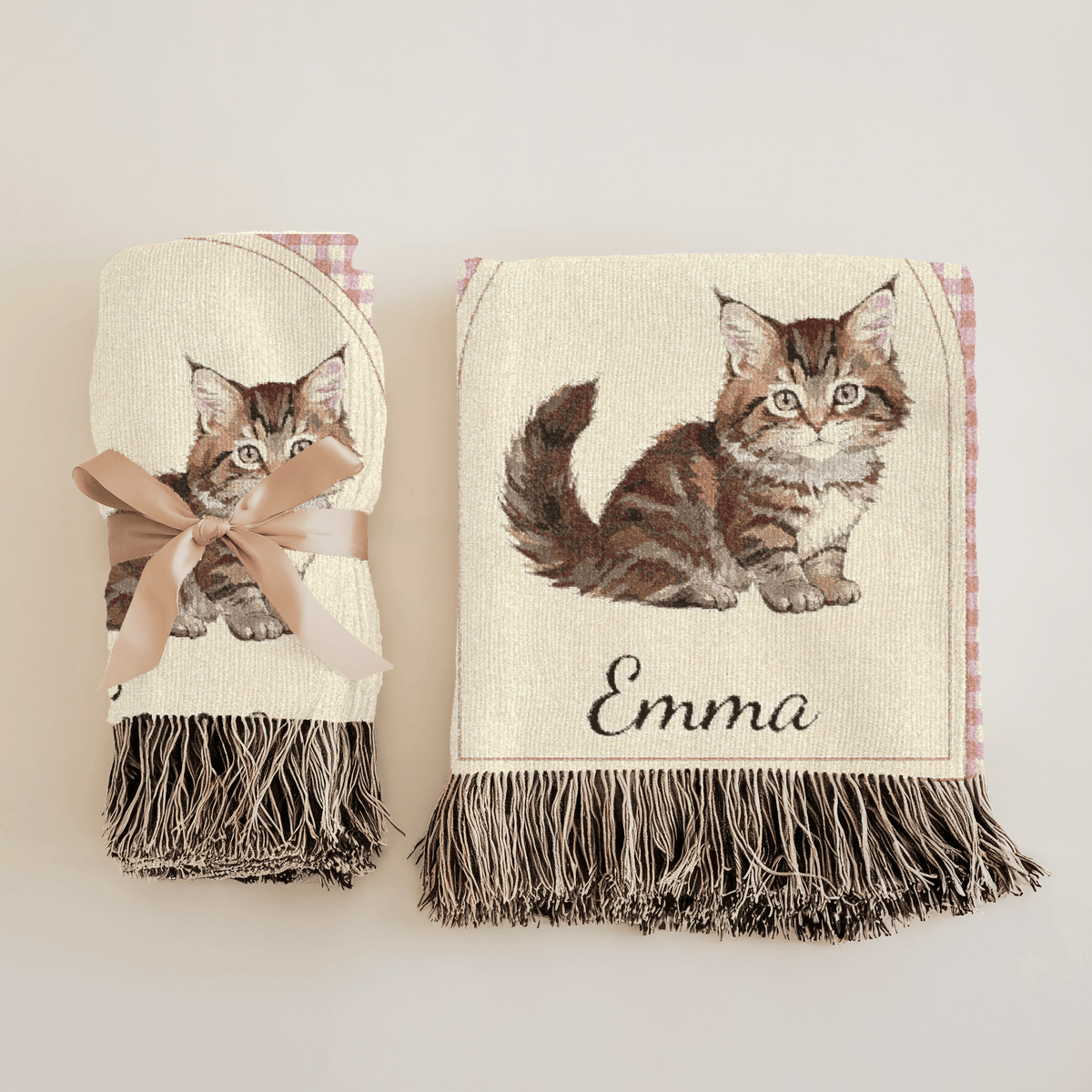 Personalized cat baby blanket over a white rocking chair in a nursery