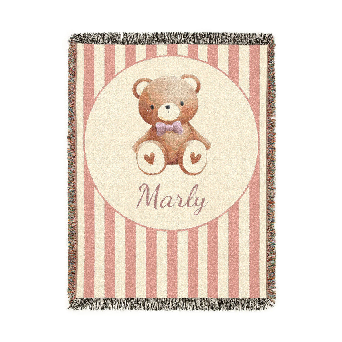 Personalized woven baby blanket with a brown teddy bear in a purple bow tie and little hearts in a cream circle on a blush pink and cream stripe, with a name woven in, shown flat