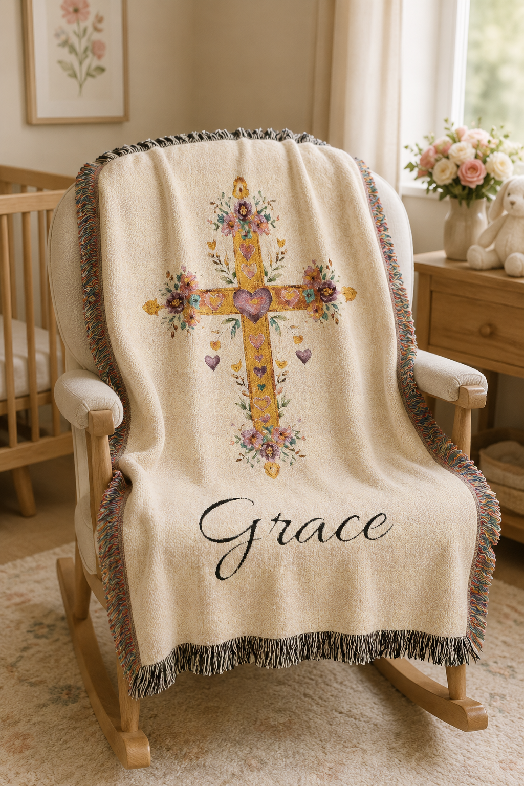 Personalized baptism blanket over a cream armchair in a nursery