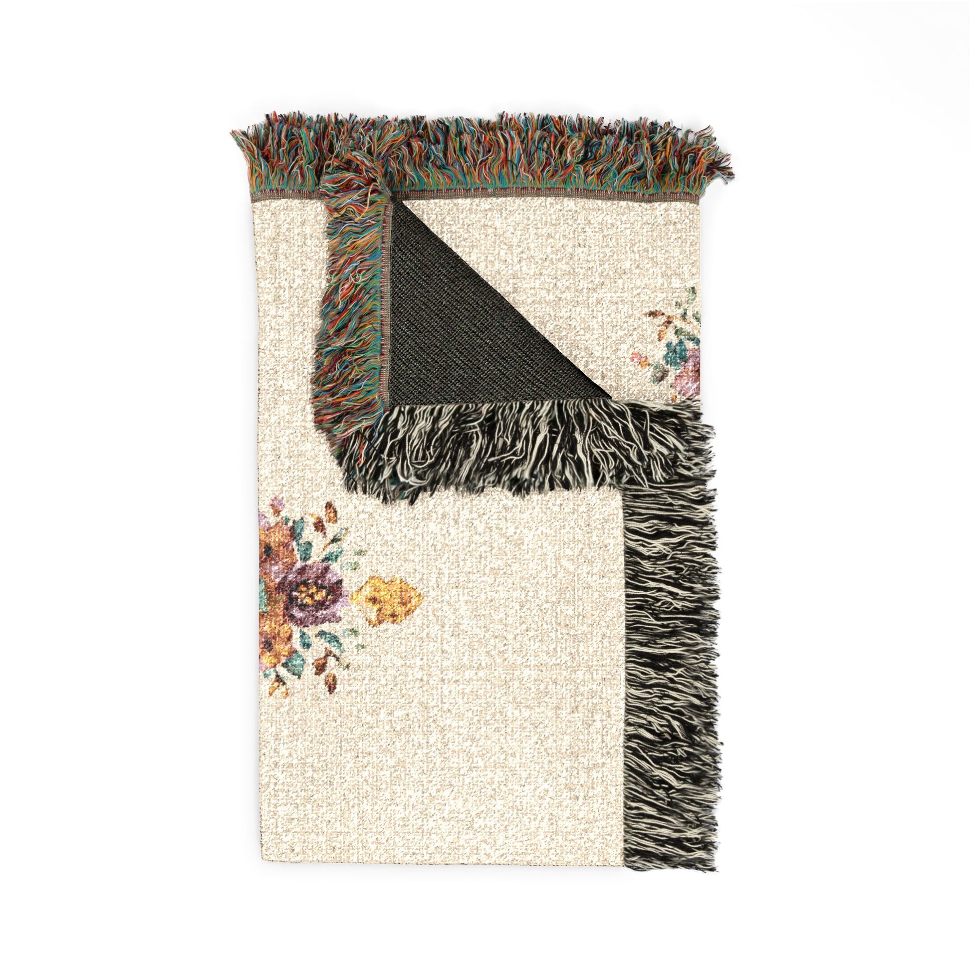 Folded personalized baptism blanket showing the fringed edge and the dark reverse side