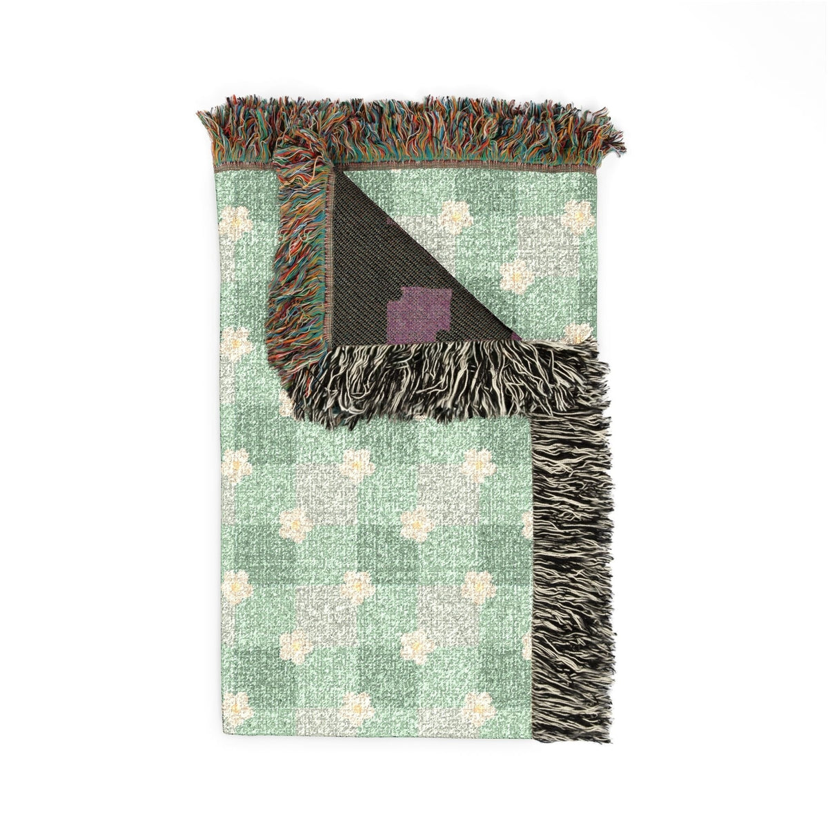 Folded corner detail of the personalized daisy gingham blanket showing the fringe edge