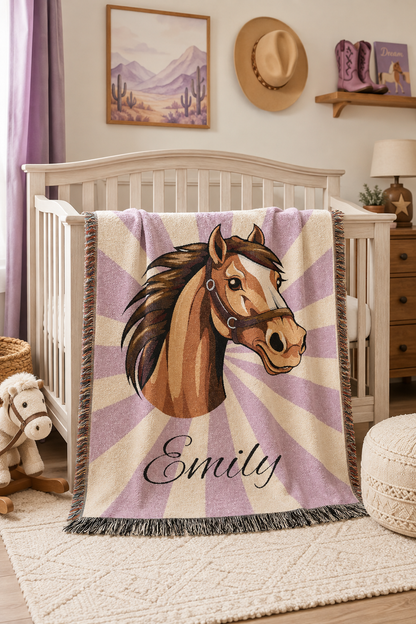 Personalized horse blanket over a crib in a lilac nursery