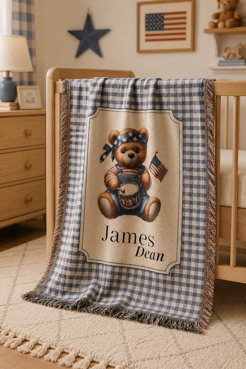 Personalized patriotic teddy bear blanket over a chair by a window with a star garland