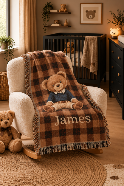 Personalized teddy bear plaid woven blanket styled on an armchair with the name visible