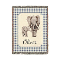 Personalized woven baby blanket with an elephant and calf on a cream panel with a blue gingham border and a name woven in, shown flat