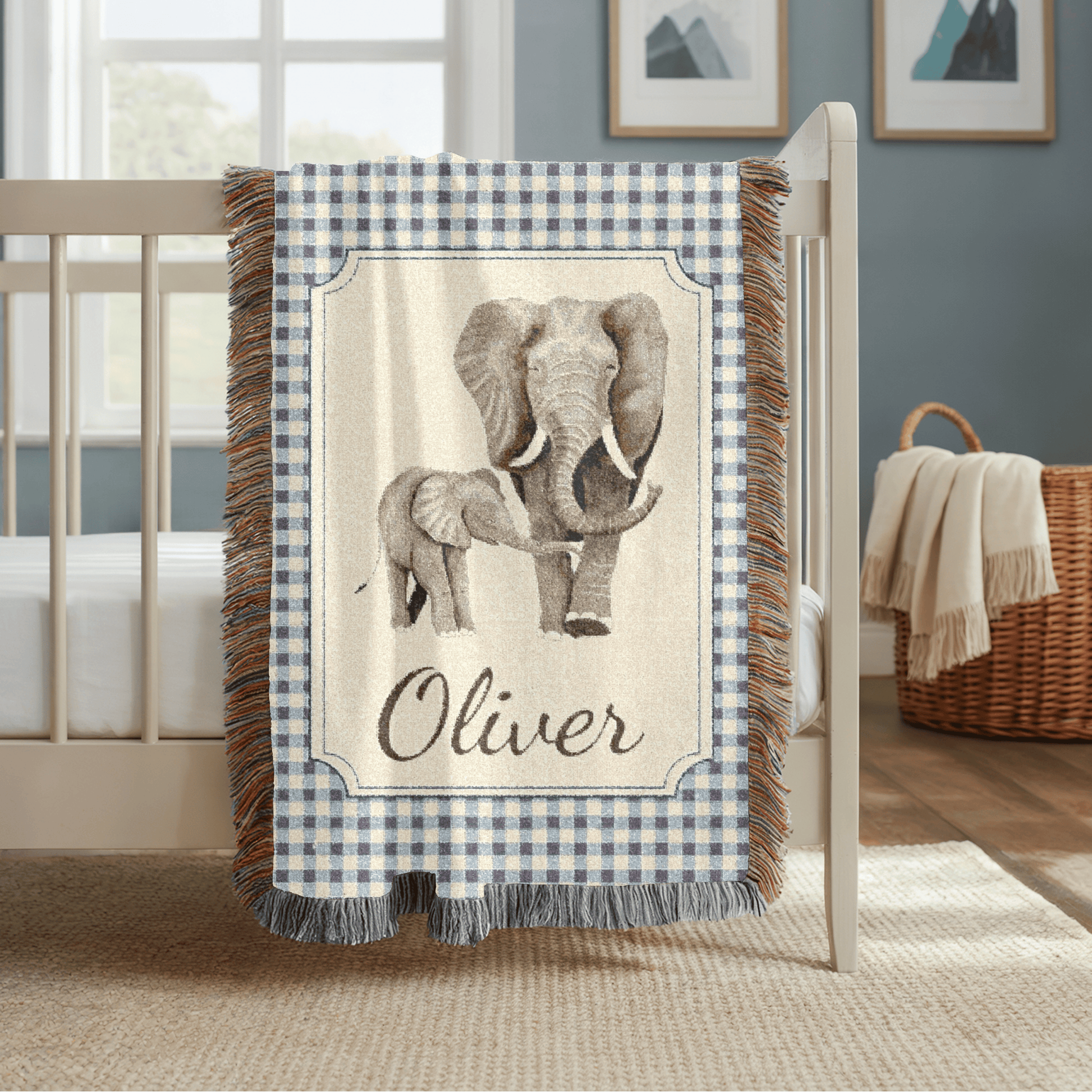 Personalized elephant baby blanket over a crib rail in a nursery with green walls