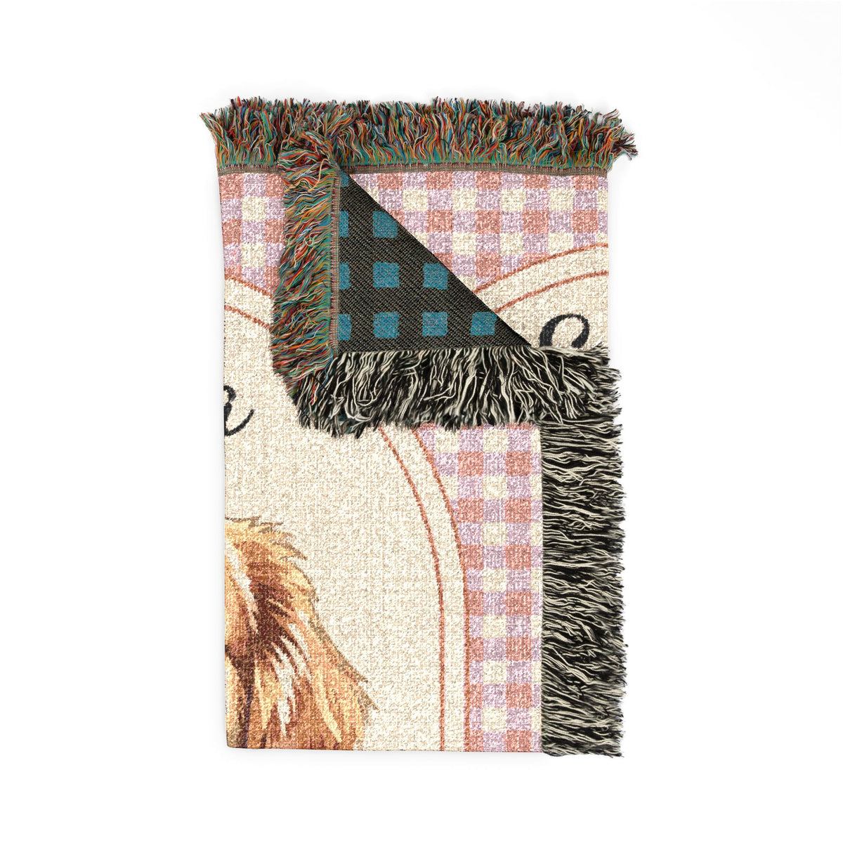 Folded personalized golden retriever blanket showing the fringed edge and the teal reverse side