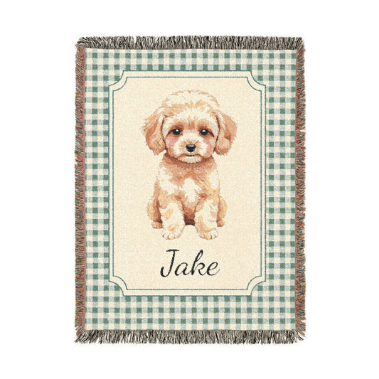 Personalized woven baby blanket with a cream apricot puppy in a framed panel on sage gingham, with a name woven in, shown flat