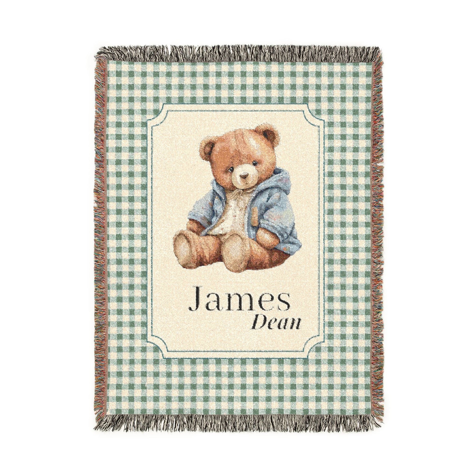 Personalized woven baby blanket with a teddy bear in a blue jacket on sage gingham, with a first and middle name woven in, shown flat