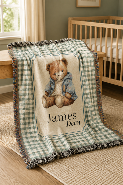 Personalized teddy bear baby blanket over a crib in a bright nursery