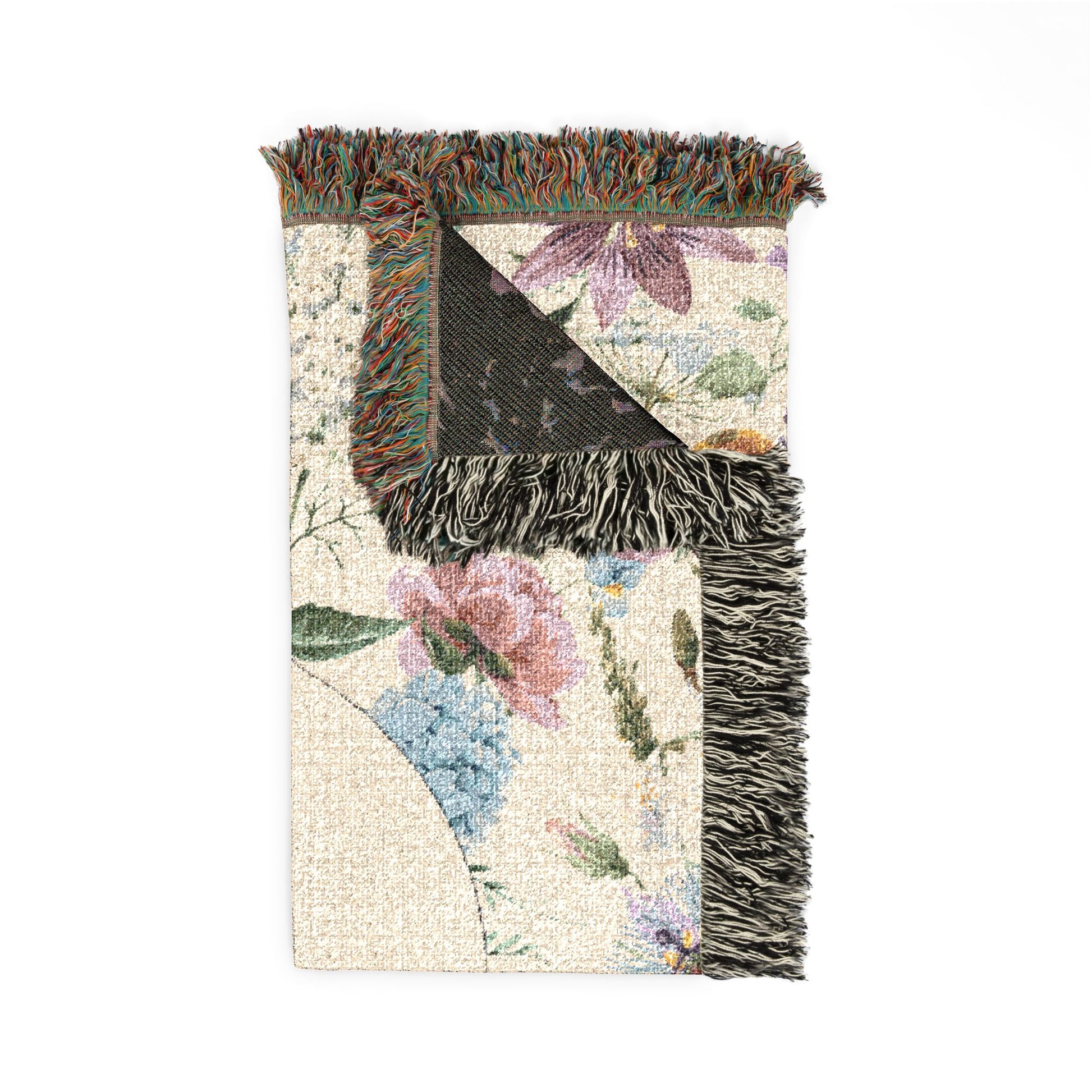 Folded personalized wildflower baby blanket showing the fringed edge and the dark reverse side