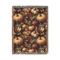 Pumpkin Harvest woven throw blanket with a dense pattern of pumpkins, gourds, acorns and leaves, front view