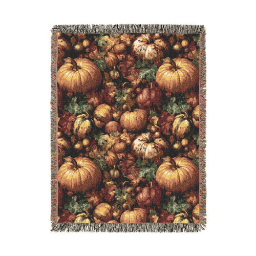 Pumpkin Harvest woven throw blanket with a dense pattern of pumpkins, gourds, acorns and leaves, front view