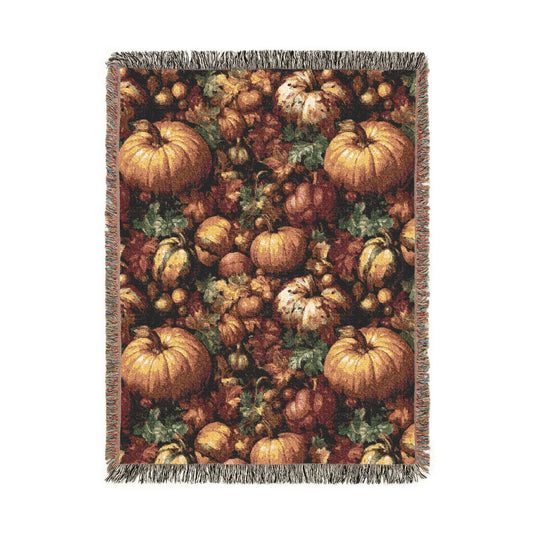 Pumpkin Harvest woven throw blanket with a dense pattern of pumpkins, gourds, acorns and leaves, front view