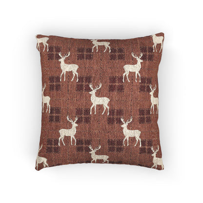 Reindeer plaid woven pillow featuring cream reindeer silhouettes on a rust buffalo-check pattern