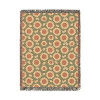 Retro Flower woven blanket with coral daisies on a sage green ground, shown flat