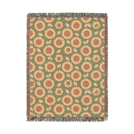 Retro Flower woven blanket with coral daisies on a sage green ground, shown flat