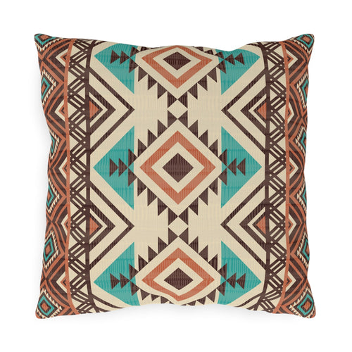 Rust and teal Aztec diamond outdoor pillow in cream with turquoise and rust diamonds, front view