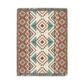 Rust and teal Aztec diamond woven blanket with concentric diamonds in navy, rust and cream, shown flat
