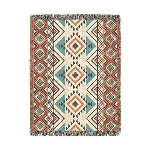 Rust and teal Aztec diamond woven blanket with concentric diamonds in navy, rust and cream, shown flat