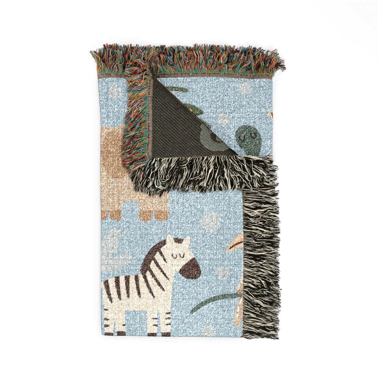 Folded safari animals woven baby blanket showing the fringed edge and the dark reverse side
