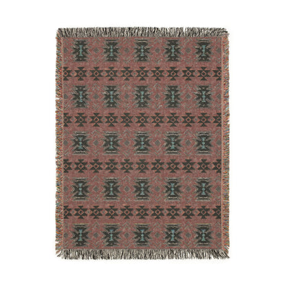 Reverse side of the sky blue Southwestern woven blanket in dusty mauve with teal medallions