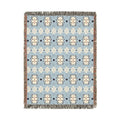 Southwestern woven blanket in pale blue with cream and navy medallion motifs, shown flat