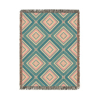 Southwestern woven blanket in teal with dusty rose and cream diamonds, shown flat