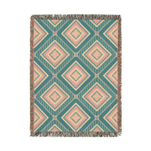 Southwestern woven blanket in teal with dusty rose and cream diamonds, shown flat