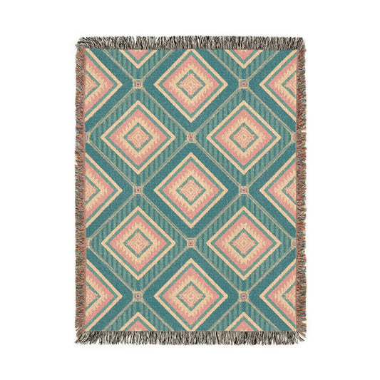 Southwestern woven blanket in teal with dusty rose and cream diamonds, shown flat