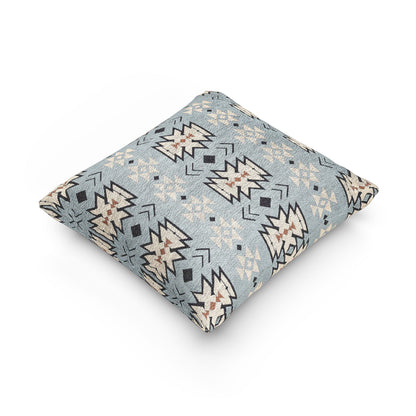 Pale blue Southwestern woven pillow shown at an angle to show its depth and seam