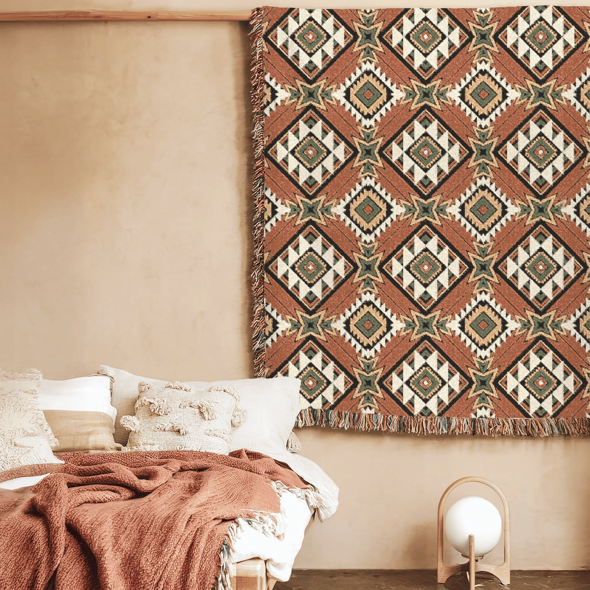 Star Medallion Aztec woven blanket styled on a bed in a cozy bedroom