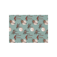 Summer Palm outdoor rug in seafoam green with coral palm trees, shown flat