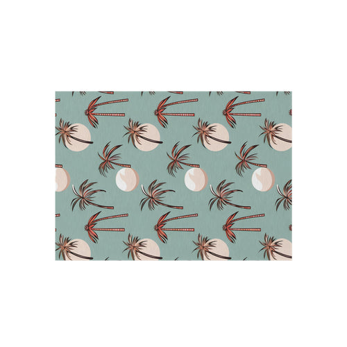 Summer Palm outdoor rug in seafoam green with coral palm trees, shown flat