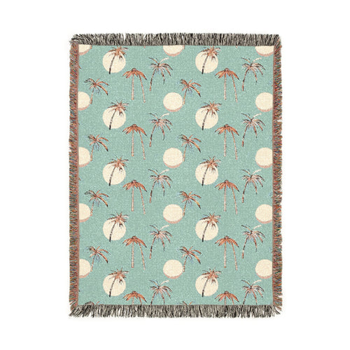 Summer palm woven blanket with tropical palm leaves, shown flat
