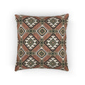 Terracotta Aztec diamond woven pillow featuring a bold southwestern geometric pattern