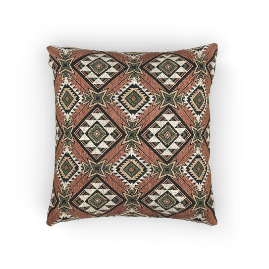 Terracotta Aztec diamond woven pillow featuring a bold southwestern geometric pattern