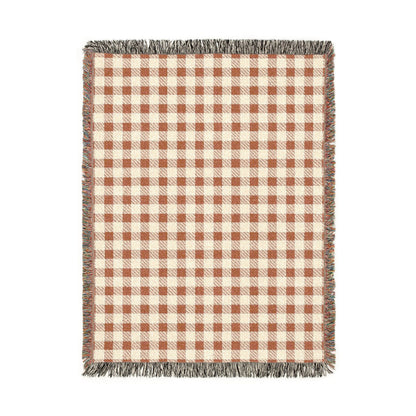 Terracotta gingham woven blanket with a rust and cream check pattern
