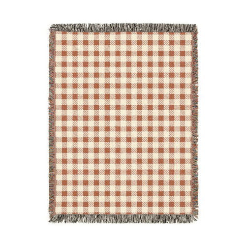 Terracotta gingham woven blanket with a rust and cream check pattern