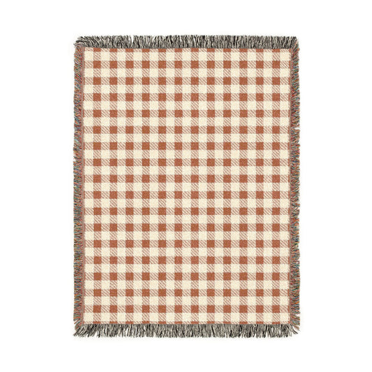 Terracotta gingham woven blanket with a rust and cream check pattern