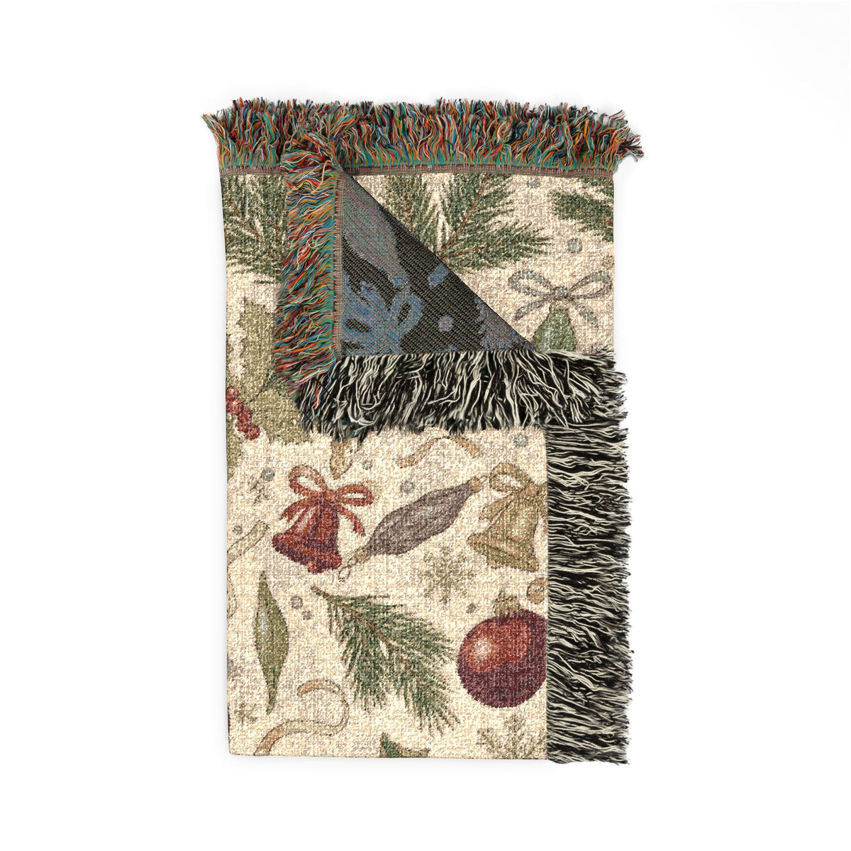 Folded corner of the vintage Christmas ornaments woven blanket showing the woven texture and fringe