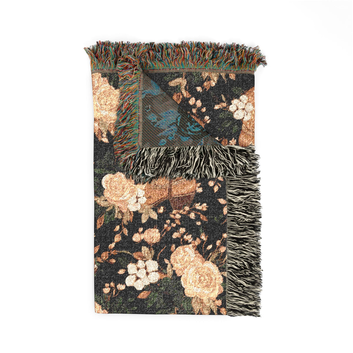 Folded Western cowboy boots woven blanket showing the fringed edge and the teal reverse side