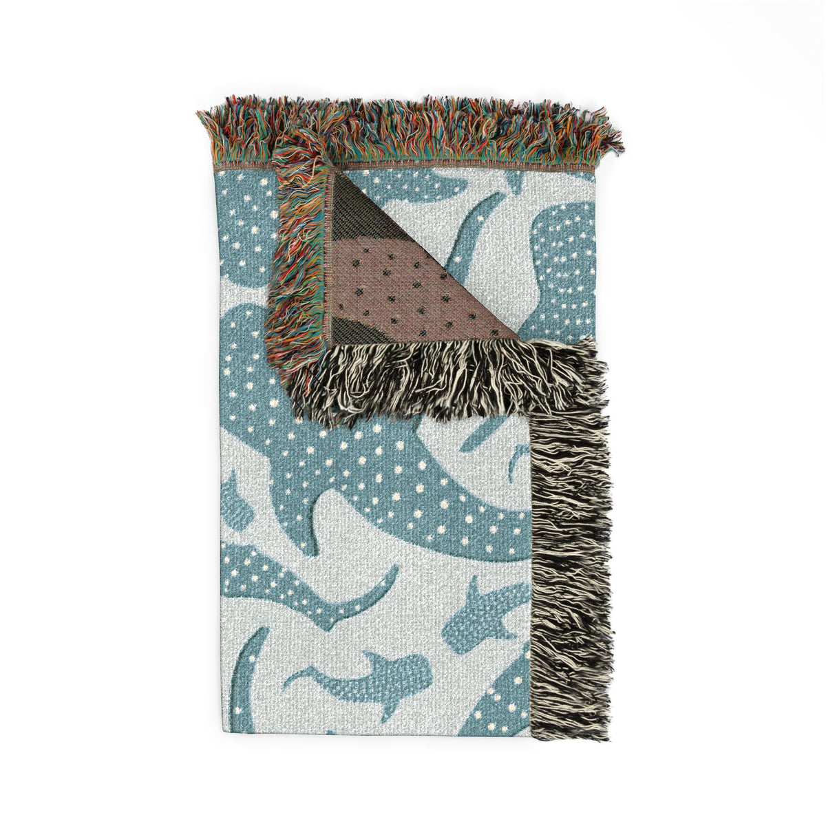 Folded Whale Shark woven blanket showing the teal front and the brown reverse side